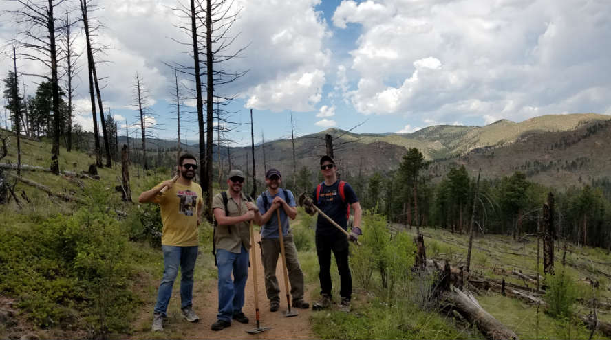 image of four NEWMEDIA team members at Buffalo Creek trail system